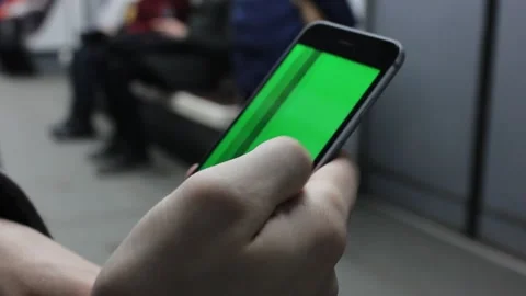 Closeup person uses mobile phone with green screen Stock Footage 123722009