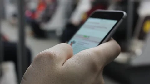Closeup person uses mobile phone at public transport Stock Footage 123722031