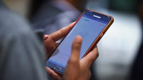 Closeup of a person using app on smartphone Stock Footage 115081898