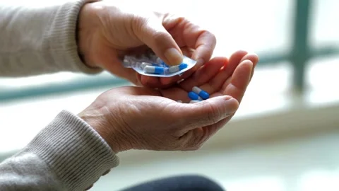 Closeup person using Medication Tablets for health medicine blister pack pill Video stock 336586231