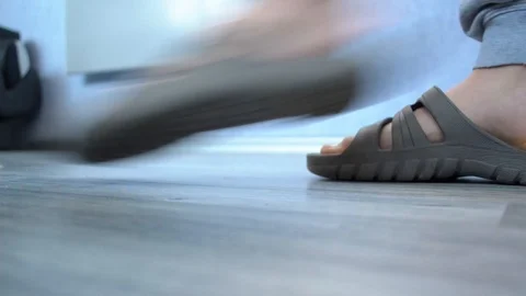 Closeup of a person's foot walking back and forth in front of camera 스톡 동영상 89422814