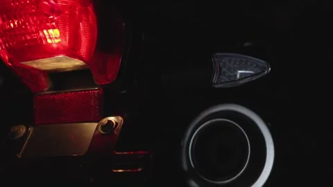A CloseUp Perspective of Motorcycle Lights at Night Captured Beautifully for Video stock 308740226