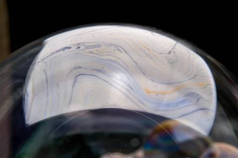 Closeup photo of colored light reflection on the surface of soap bubble 스톡 사진