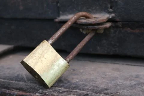 Closeup Photo of the Rustic Old Padlock and a Wooden Box Stock Photos