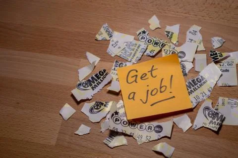 Closeup photo of sticker note on teared up lottery tickets of Power Ball and  Stock Photos