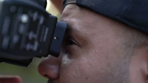 Closeup of a photographer, blurred background Stock-Footage 82472643