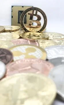 Closeup of physical bitcoin and computer cpu processor 写真素材