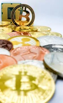 Closeup of physical bitcoin and computer cpu processor 스톡 사진