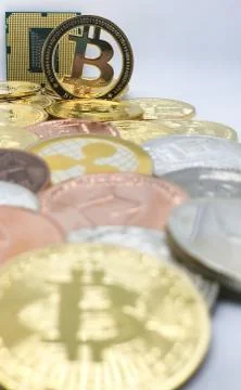 Closeup of physical bitcoin and computer cpu processor 写真素材