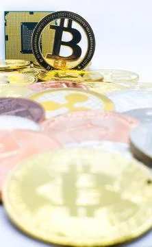 Closeup of physical bitcoin and computer cpu processor Stock Photos