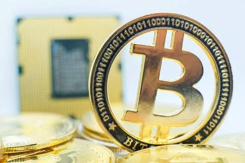 Closeup of physical bitcoin and computer cpu processor Antwerp, Belgium, F... 写真素材