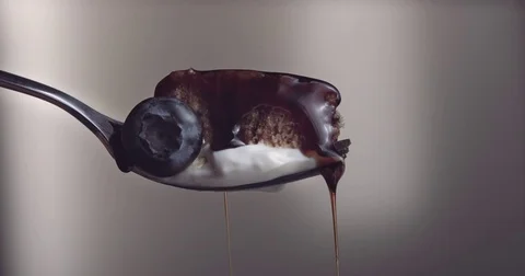 Closeup piece of cake on fork with mapple suryp falling down Video stock 76550982