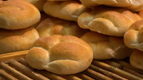 Closeup on a pile of bread rolls on a shelf in a store Stock-Footage 103091970