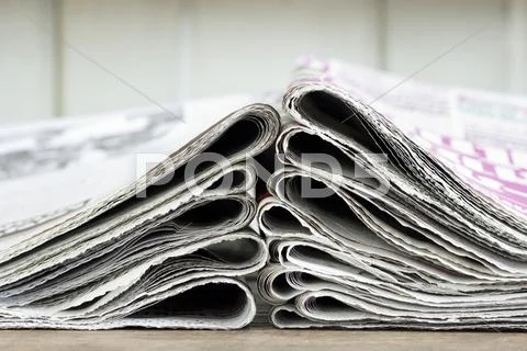 Closeup pile of newspaper Stock Photos