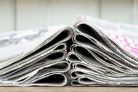 Closeup pile of newspaper Stock Photos