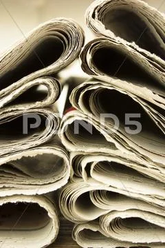 Closeup pile of newspaper Stock Photos