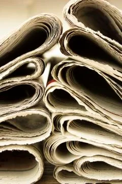 Closeup pile of newspaper Stock Photos