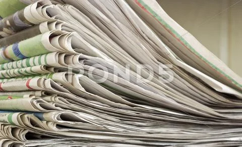 Closeup pile of newspaper Stock Photos