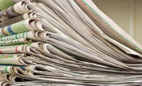 Closeup pile of newspaper Stock Photos