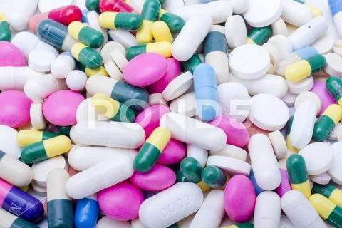 Closeup at Pile of Pills, Tables and Capsules Stock Photos