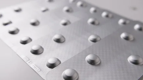 Closeup Of Pills With Blister Package Representing Healthcare 4K Stock Footage 86082635