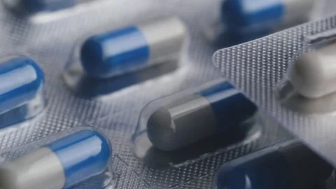Closeup of pills lying on table. Illness and sickness concept Stock Footage 72724836