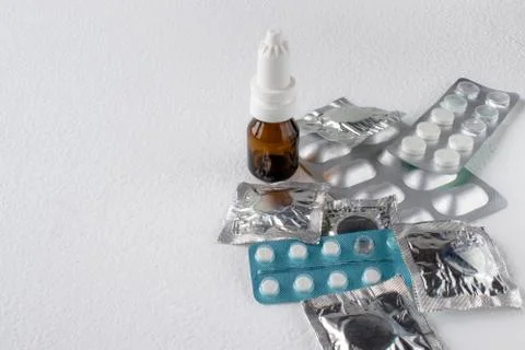 Closeup of pills in pack on light background. Different types of pills. Stock Photos