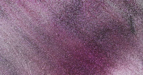 Closeup of pink glitter background in studio waves and shines bright.  Stock Footage 149364805
