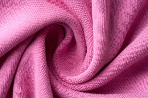 Closeup pink texture of woolen knitted fabric. Pattern of pink crumpled fabri Stock Photos