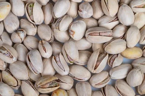 Closeup pistachio shells forming repeating pattern, soft neutral palette and  Stockfoto's