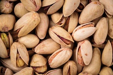 Closeup on pistachios in shell background texture Stock Photos