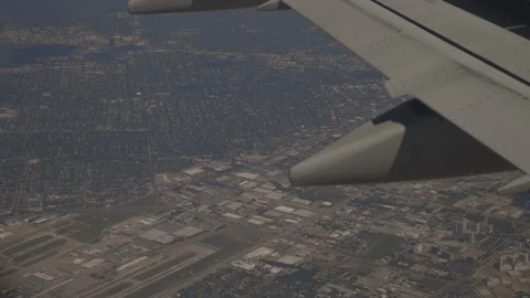 Closeup On Plane Wing Looking At The Land Below Stock Footage 118096289