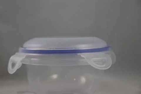 Closeup of plastic food container that locks and has blue trim Stock Photos