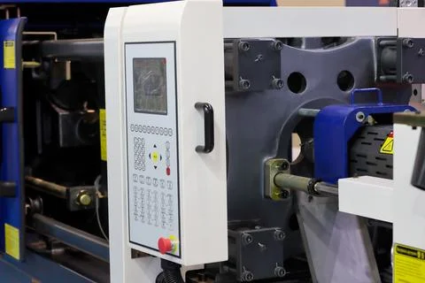 Closeup of plastic injection molding press machine Stock Photos