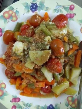 Closeup of a plate of boiled vegetables with peanut sauce Stock Photos