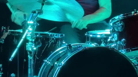 Closeup playing drums drum kit cymbal rock n' roll band music blue neon glow Stock Footage 310070720