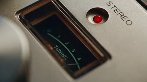Closeup pointer moving tuning scale on retro radio. Signal meter tracking 動画素材 332617713
