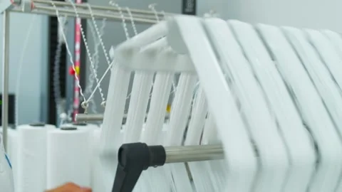 Closeup of polymer thread on the winding wheel in process of winding Stock Footage 202111126
