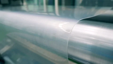 Closeup of polypropylene coming through rollers ready for molding Stock Footage 145046270