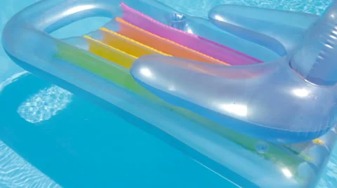 Closeup of Pool Raft Floating on a Swimming Pool Stock Footage 64111847