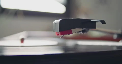 Closeup of portable vintage headshell of record player going down playing on Stock-Footage 131301870