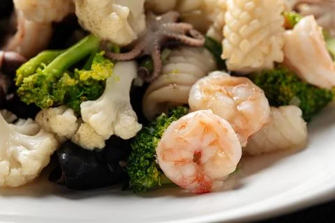 Closeup on portion of assorted seafood dish Stock Photos
