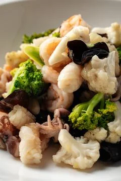 Closeup on portion of assorted seafood dish Stock Photos