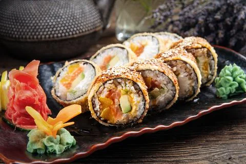 Closeup on portion of deep fried sushi rolls Stock Photos