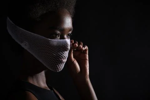 Closeup portrait of african american woman fashion model wearing quarantine Stock Photos