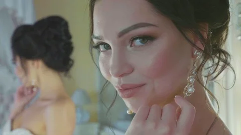 Closeup portrait of beautiful bride looking at camera and posing Stock Footage 85002854
