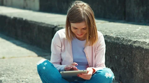 Closeup portrait beautiful student using your tablet pc Stock Footage 64738641