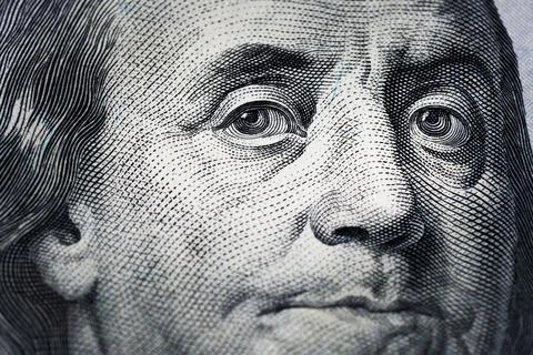 Closeup portrait Benjamin Franklin on 100 us dollar bill. Stock Photos