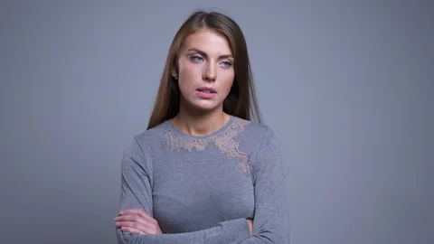 Closeup portrait of bored and sad young caucasian woman having her arms crossed Video stock 101020143