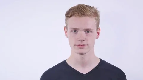Closeup portrait of dumb clueless funny looking young man. Negative human Stock Footage 69233076